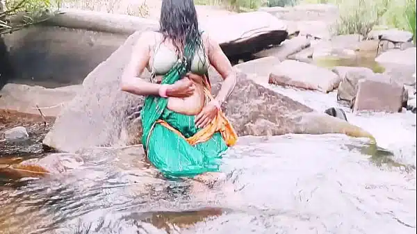 Villege aunty outdoor water fall bathing. Telugu dirty talks.