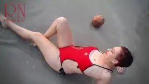 Nice lady at lonely nudist beach. Red swimsuit. Red bikini. Coconut