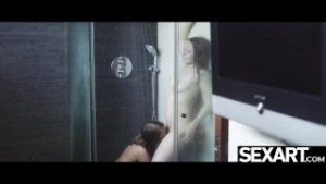 Naked beauties have intense lesbian sex in steamy bathroom